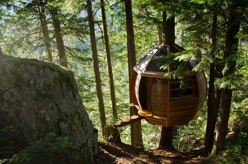 hemloft secret treehouse hiding in the woods of whistler canada 2 A Transparent Cabin of Wood and Mirrors on a Desert Landscape