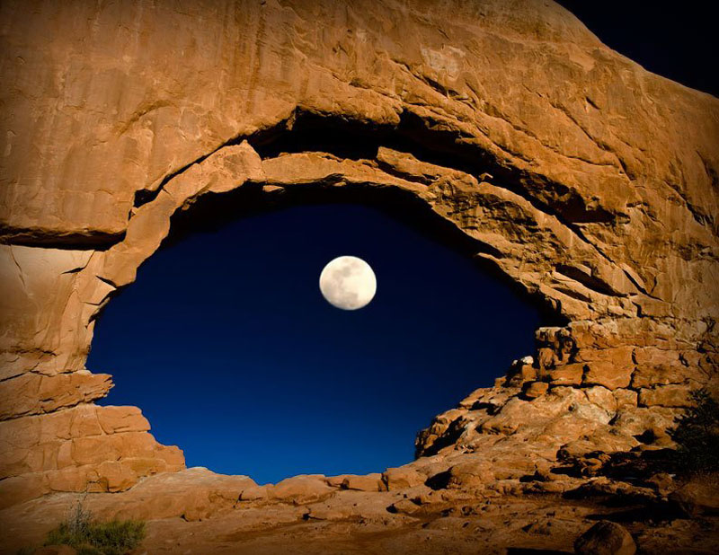 the moon through north window arches national park utah united states