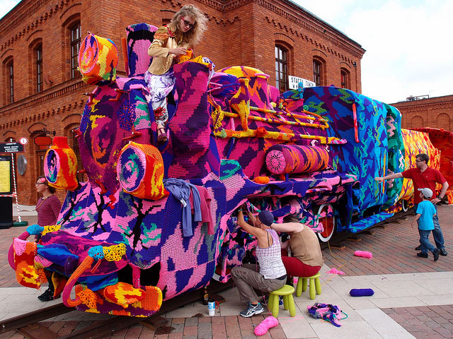 crocheted locomotive lodz poland by artist olek 9 Building Sized Street Art Portraits by Natalia Rak