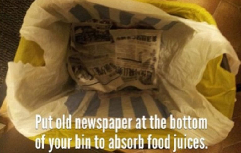 put newspaper at bottom of garbage to soak up liquids life hack 40 Clever Life Hacks to Simplify your World