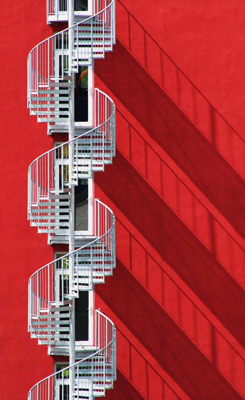 spiral staircase and shadows red white