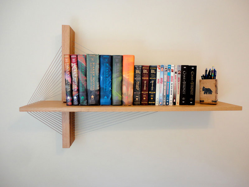 furniture held together just by tension robby cuthbert 1 Floating Bookshelves Held Up By a Magnetic Superhero