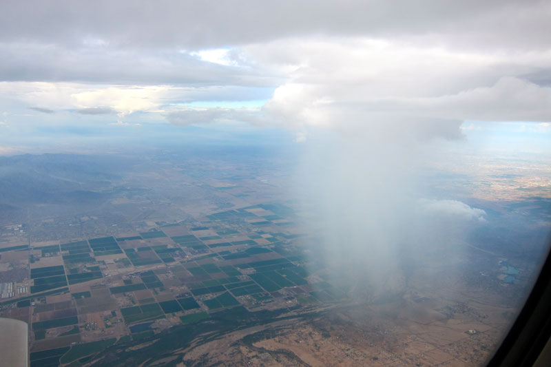 rain cloud seen from airplane window 21 Terrifyingly Beautiful Photos of Incoming Storm Clouds