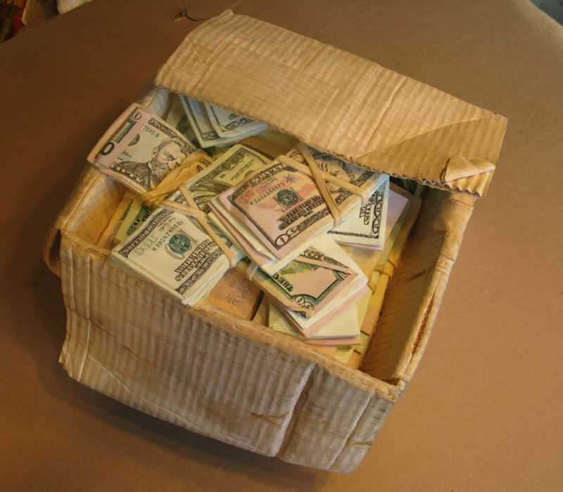 randall rosenthal carves a block of wood into a box of money (14)
