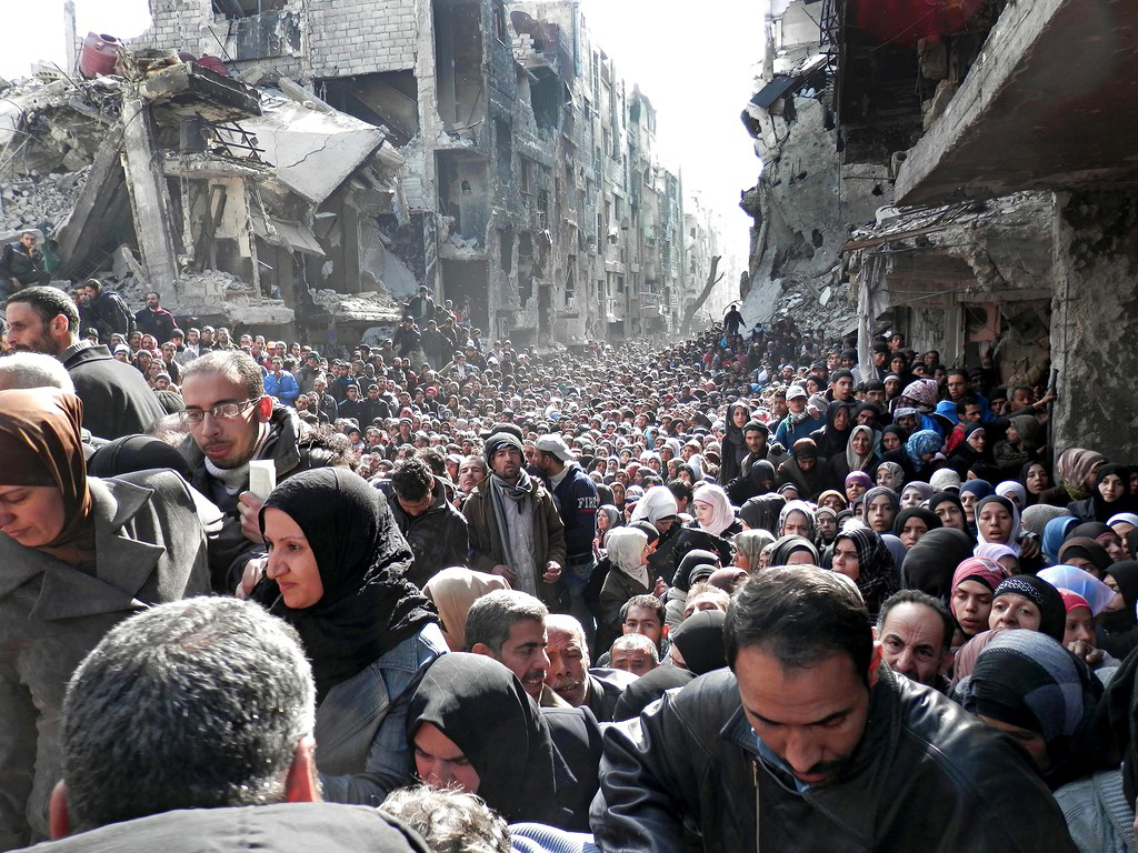 waiting for food at refugee camp in yarmouk damascus syria Picture of the Day: Waiting for Relief