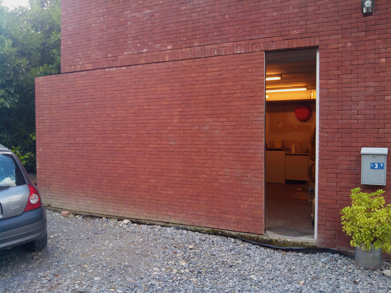 brick wall is actually a sliding door Picture of the Day: Super Sneaky Sliding Brick Wall Door