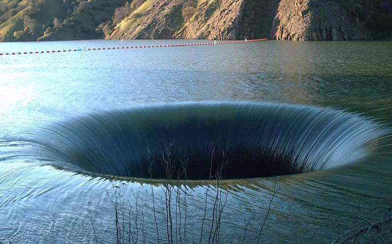 Bell-Mouth Spillways: How Giant Holes in the Water are Possible