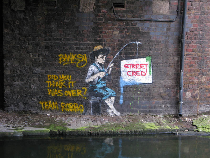 banksy fishing for streed cred robbo war Street Artist and City Worker Have Year Long Exchange on a Red Wall in London