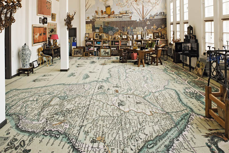 room with map floor, africa printed onto very large carpet that covers entire floor