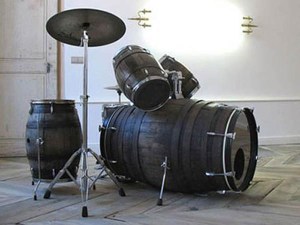 using old barrels to make a drum set