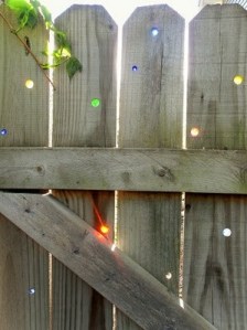 marbles used to plug holes in outdoor fences