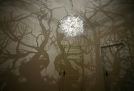 Chandelier Projects Spooky Shadow Forest onto Walls