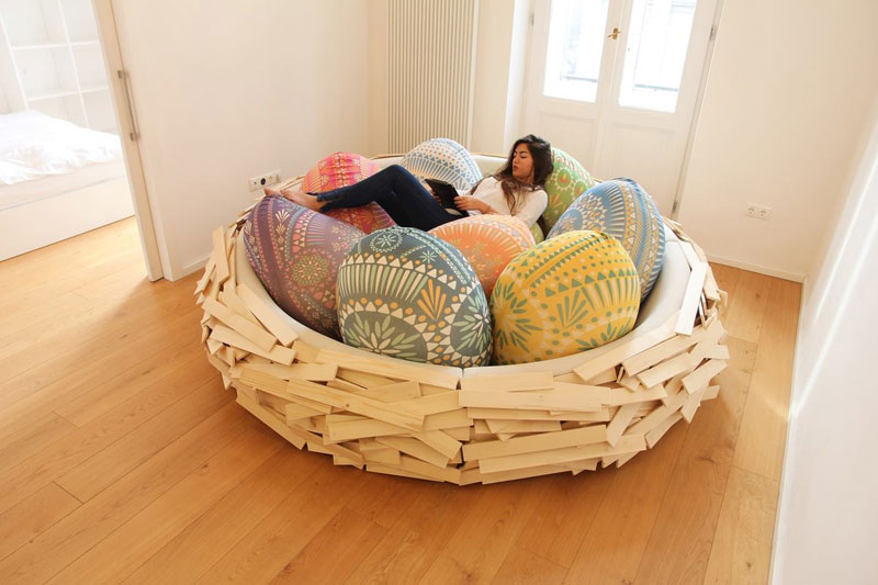 giant birds nest by oge creative group 3 Floating Bookshelves Held Up By a Magnetic Superhero