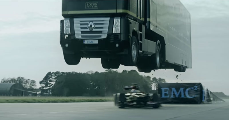 Truck Makes Record Breaking 83 ft Jump Over a Moving F1 Car