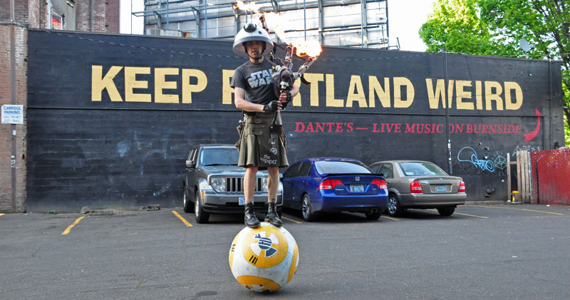 Just a Guy Riding a Giant Ball Playing Star Wars with a Flaming Bagpipe