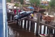 Truck Attempts to Board a Ship Over Planks