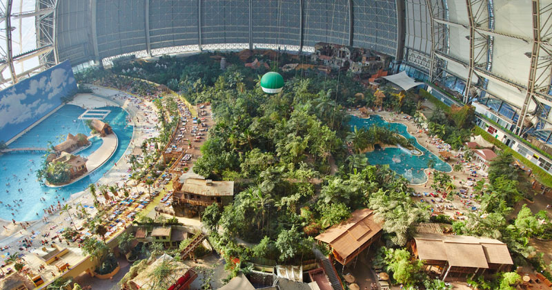 tropical islands resort the giant waterpark inside an old german airship hangar cover A Clever Hotel Room Loft Designed for Longer Stays