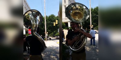 Guy Playing Giant Sousaphone Follows KKK Marchers to a Rally