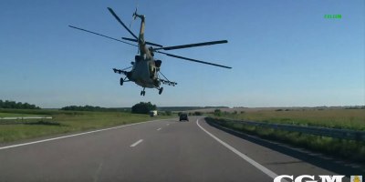 Riding With a Helicopter Down a Highway in Ukraine