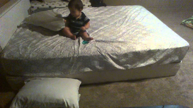 Brilliant Baby Uses Pillows to Soften Landing from Bed to Ground