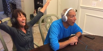 Parents Put on Headphones and Try to Lip Read Their Son's Baby Announcement