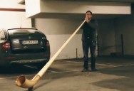 Guy Plays Alphorn Inside Underground Parking Lot