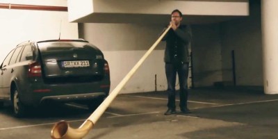 Guy Plays Alphorn Inside Underground Parking Lot