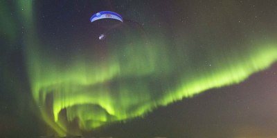 Guy Goes Paragliding Through Aurora Borealis in Norway