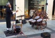 Awesome Street Performer Juggles Mallets and Plays Drums at the Same Time