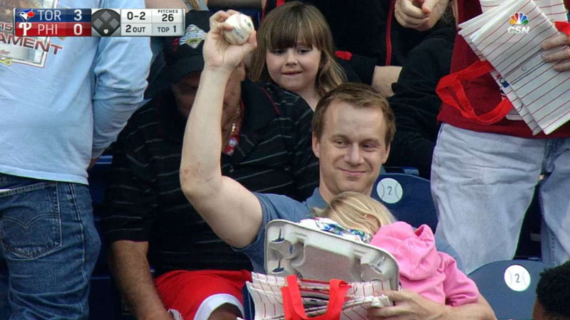 Chill Dad Makes Casual One-Handed Grab While Holding Child and Hot Dogs