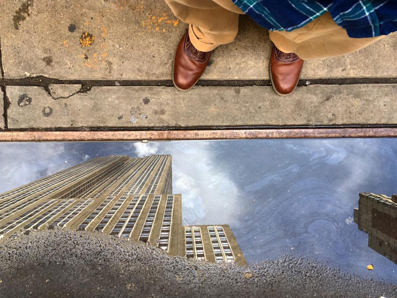 empire state building puddle reflection by ben hipp Picture of the Day: Empire State Puddle Reflection