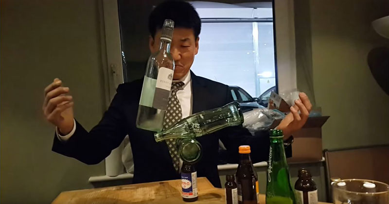 Guy Casually Balances 4 Random Bottles at a Cocktail Party