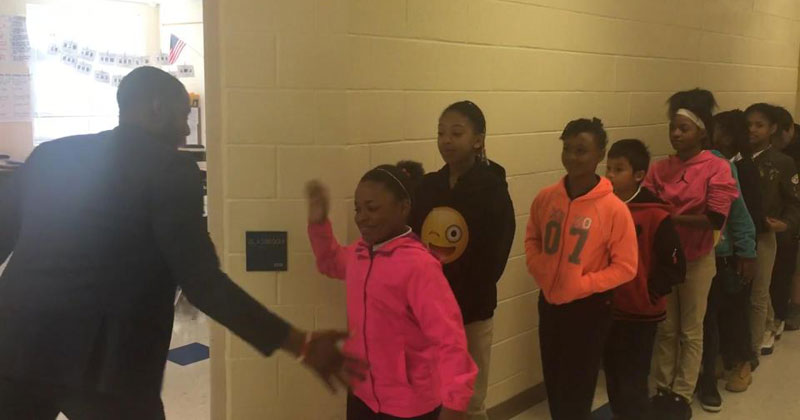 This Teacher Has a Special Handshake with Every Single Student in his Class