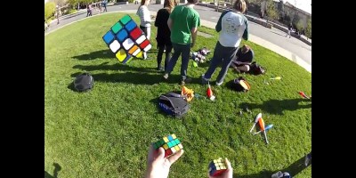 Guy Solves 3 Rubik's Cubes.. While Juggling Them