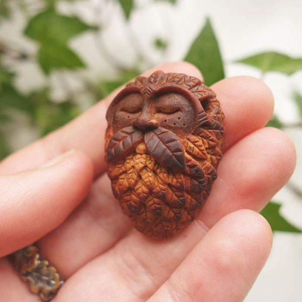 avocado stone faces carved by jan campbell 6 Waste Not, Want Not: Artist Carves Avocado Pits Into Tiny Forest Spirits