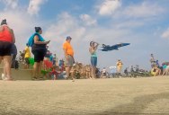 Blue Angel Sneaks Behind Crowd For Surprise Low Pass Flyby