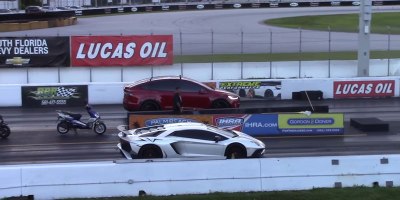 1/4 Mile Drag Race: Tesla Model X P100D vs Lamborghini Aventador SV
