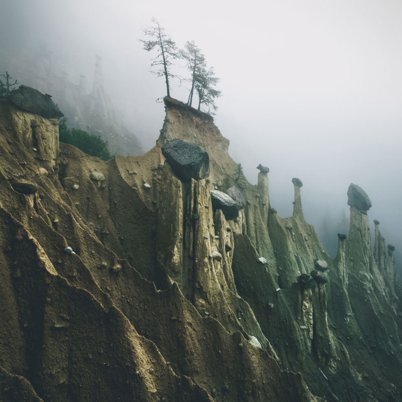 earth pyramids of south tyrol kilian schonberger otherworld 1 The Earth Pyramids of Italy: Where Boulders Perch Atop Pillars of Clay