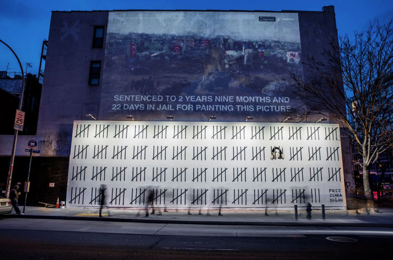 New Banksy's Appear in NYC, Including Giant Mural of Imprisoned Artist