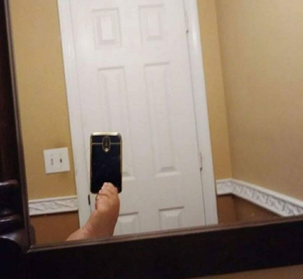 21 Pictures of People Trying to Take Photos of Mirrors They’re Selling