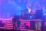 The Killers Brought a Fan on Stage and He Killed It In Front of 65,000 People