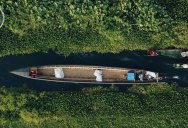 Drone Captures Boat Traffic Through Floating Gardens and Villages from Above