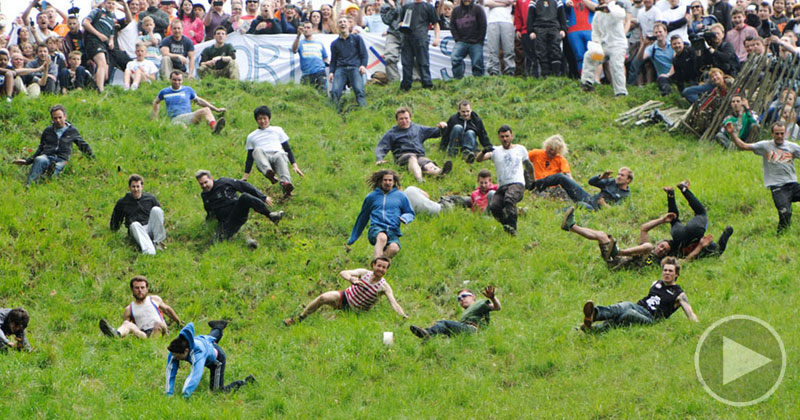 Slow Motion Wipeouts of People Chasing Cheese Down a Hill Set to Classical