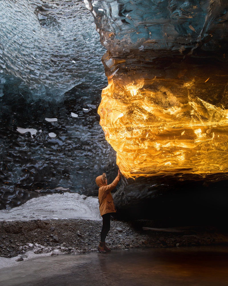 setting sun turns ice cave in iceland into amber by sarah bethea Setting Sun Turns Ice Cave in Iceland Into Amber