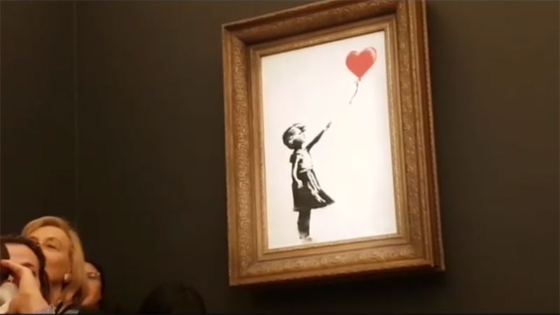 banksy shredder auction 6 Banksy Artwork Self Destructs after Selling for $1 Million at Auction
