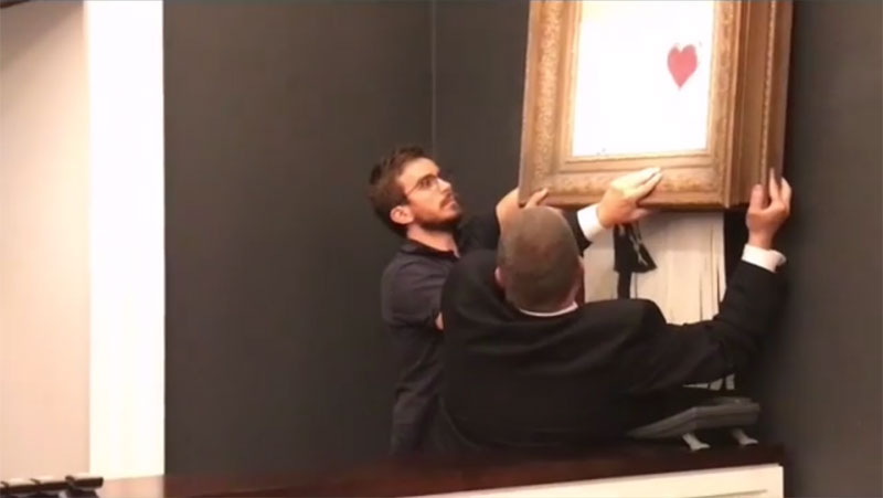 banksy shredder auction 8 Banksy Artwork Self Destructs after Selling for $1 Million at Auction