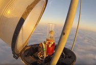 Changing a Bulb Atop a 2000 Ft Tower Looks As Crazy As It Sounds