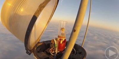 Changing a Bulb Atop a 2000 Ft Tower Looks As Crazy As It Sounds