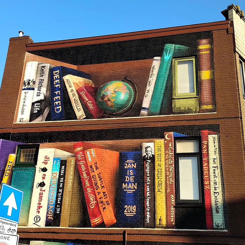giant 3d bookshelf street art by jan is de man and deef feed 7 Dutch Artists Paint Giant 3D Bookshelf of Neighborhoods Favorite Books