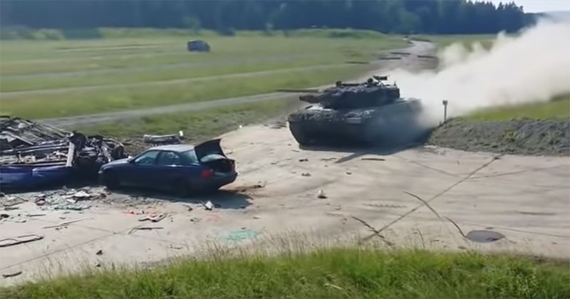 A Stationary Vehicle Versus a Tank at Full Speed